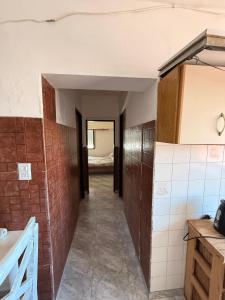 an empty hallway in a room with a bathroom at San Jorge in San Clemente del Tuyú