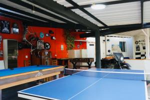 a ping pong room with two ping pong tables at Eco Hotel El Acuario in San Jerónimo