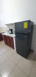 Kuchyň nebo kuchyňský kout v ubytování Macas Comfort Apartment