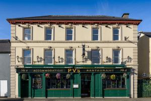 a large building with a green front door at Pv Fallons in Longford