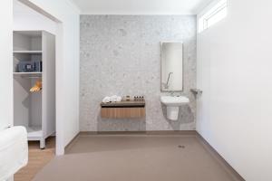 a bathroom with a sink and a mirror at Best Western Cambridge Hotel Kununurra in Kununurra +22 photos