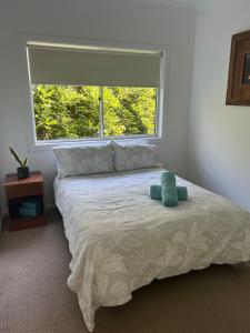 En eller flere senge i et værelse på Bellingen Dreaming