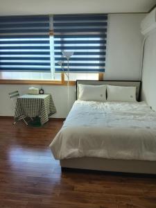 Postel nebo postele na pokoji v ubytování U&i펜션