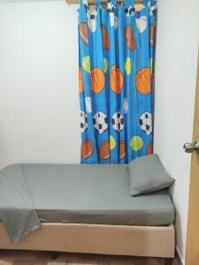 a bed in a room with a curtain at La casita de jo in Cartagena de Indias