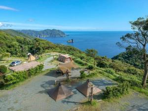 an aerial view of a group of tents near the water at Minamiizu Yuhigaoka Camp Site - Camp - Vacation STAY 42067v in Ihama
