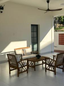 a living room with two chairs and a table at The Vista My Hoa in Ninh Hải