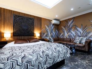 Ένα ή περισσότερα κρεβάτια σε δωμάτιο στο Tabist Manis RESORT VILLA