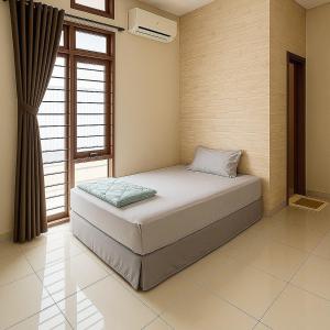 Ένα ή περισσότερα κρεβάτια σε δωμάτιο στο Pasteur House