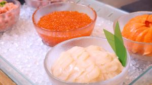 a group of bowls of food on a glass tray at Dormy Inn Premium Otaru in Otaru