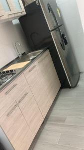 Η κουζίνα ή μικρή κουζίνα στο Casa Eloisa II - Apartamento cómodo y acogedor