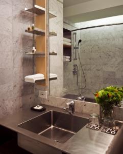 
a bathroom with a sink and a toilet at Arthouse Hotel in New York
