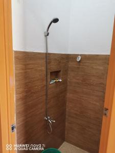 a shower with a shower head in a bathroom at Ollie's Place in Alcoy