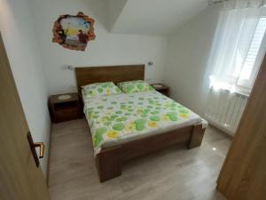 a bedroom with a bed in a room at One Bedroom Apartment with Balcony and Sea View in Sveta Nedelja