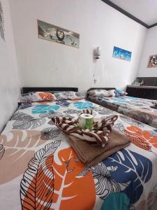 Postel nebo postele na pokoji v ubytování Subangan Surf2, Burgos Central location