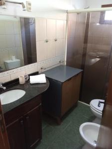 a bathroom with a sink and a toilet at Costa Pinar in El Pinar