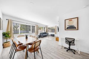 a living room with a table and chairs at Spacious Fort Lauderdale Bungalow 10mins Airport & Beach Near Miami in Fort Lauderdale