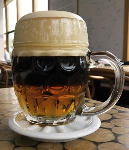 a mug of beer with a face drawn on it at tvrz Holešice Orlická přehrada - Chaty in Kamenice