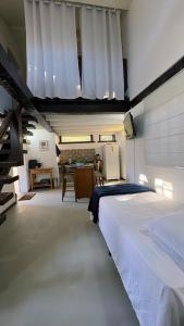 Giường trong phòng chung tại Chalé búzios