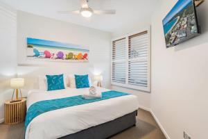a bedroom with a large bed and a window at Sea Esta - Lennox Head in Lennox Head