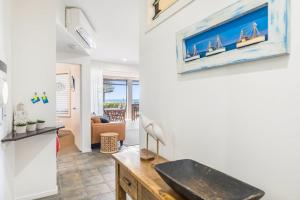 a kitchen and living room with a sink in a house at Sea Esta - Lennox Head in Lennox Head