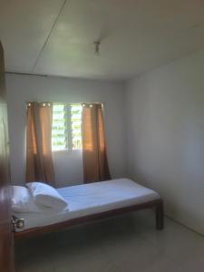 Postel nebo postele na pokoji v ubytování Manava'ofa Place + 13 fotografií