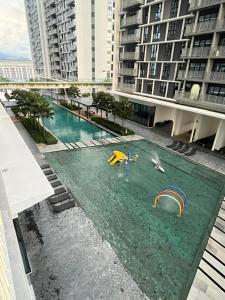 an overhead view of a pool of water with slides at Batu Kawan Condo in Simpang Ampat