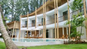 an exterior view of a resort with a swimming pool at The TALAY in Ban Na Tai +19 photos