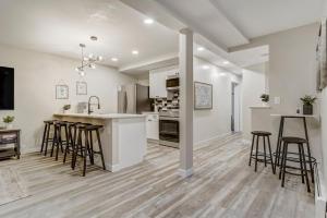 a kitchen with white walls and bar stools at 4925 Pike Unit2 in Cascade-Chipita Park
