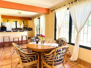 a dining room with a wooden table and chairs at Large family house in Cabo , pet friendly in Cabo San Lucas