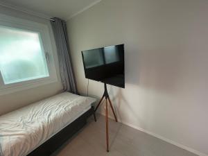 TV a/nebo společenská místnost v ubytování gam rooftop