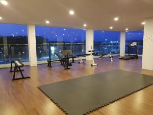 a room with a gym with a large window at The Vista Hotel By Satit Group in Sadao