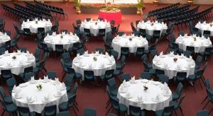a room filled with tables and chairs with white table cloth at Hotel Ruposhi Bangla in Bāg Noādda +48 photos