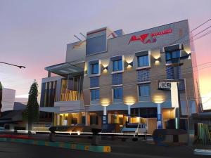 un rendu d'un hôtel avec des chaises devant dans l'établissement Mega Permata Hotel, à Padangsidimpuan