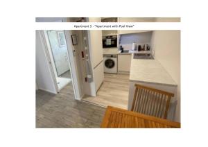 a kitchen with a counter top and a kitchen with a refrigerator at Stay n Play n Russell in Russell