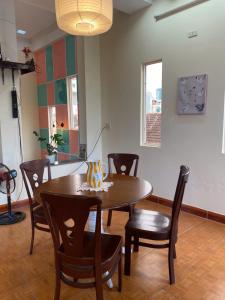 a dining room with a table and chairs at Green home in Da Nang