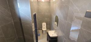 a bathroom with a sink and a shower at Hotel Nakshatra in Sawāi Mādhopur +65 photos