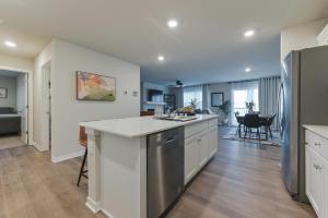 a kitchen and living room with a counter top at Charming & family friendly NE Ankeny -Entire home in Ankeny +34 photos