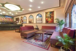 a waiting room with couches and tables in a store at FabHotel Jai Mangal Palace - Sindhi camp bus stand, Jaipur railway station,Sindhicamp metro station in Jaipur