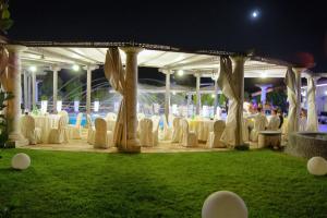 a group of tables and chairs under a tent at Villa Masseria Marini in San Giuseppe Vesuviano +24 photos