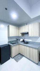 a kitchen with a sink and a counter top at WV 32 Urban Scenic Studio in Sampong