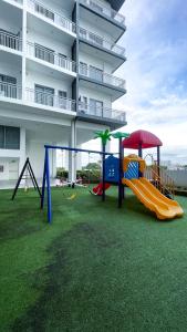 a playground in front of a building at WV 32 Urban Scenic Studio in Sampong