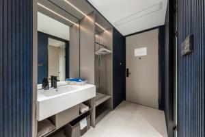 a bathroom with a sink and a mirror at Shanghai Jiading Pingcheng Road Atour Light Hotel in Shanghai +40 photos