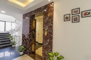 a hallway with a door in a house at FabHotel Pitampura in New Delhi