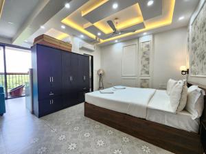 a bedroom with a large bed in a room at Romantic Goa Studio with Mangrove view - Walk to Candolim Beach, Ideal for Couples in Candolim +36 photos