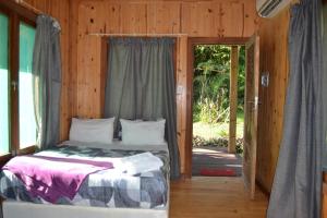 Ένα ή περισσότερα κρεβάτια σε δωμάτιο στο Onda Azul Family Unit