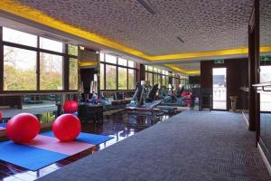 a gym with a lot of pilates equipment at Eden Club House in Tongxiang