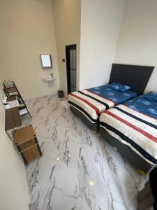 Postel nebo postele na pokoji v ubytování AJA Tumpaksewu Homestay