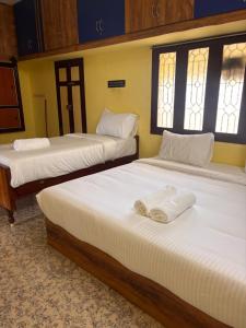 Postel nebo postele na pokoji v ubytování Ram Sethu Home Stay