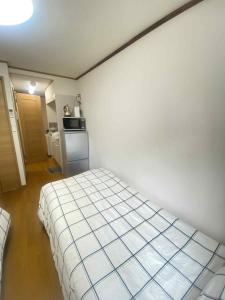 Kuchyň nebo kuchyňský kout v ubytování Poppy ikebukuro