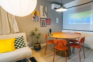 a small dining room with a table and chairs at Otter Stay Lite - Shinsakae in Nagoya